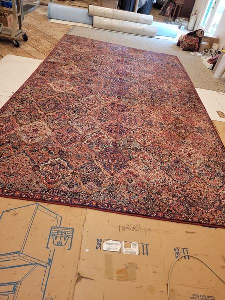 A Large Rug is Sitting on Top of a Cardboard Box