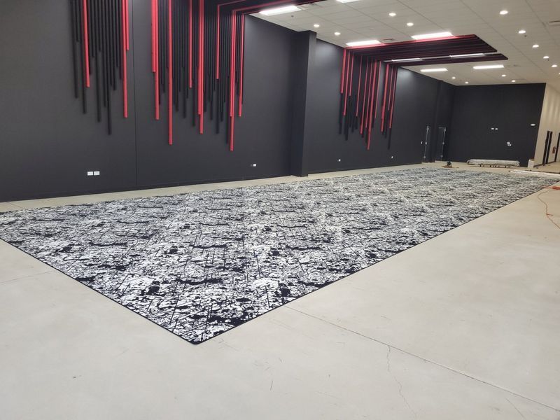 A Large Room With a Large Rug on the Floor