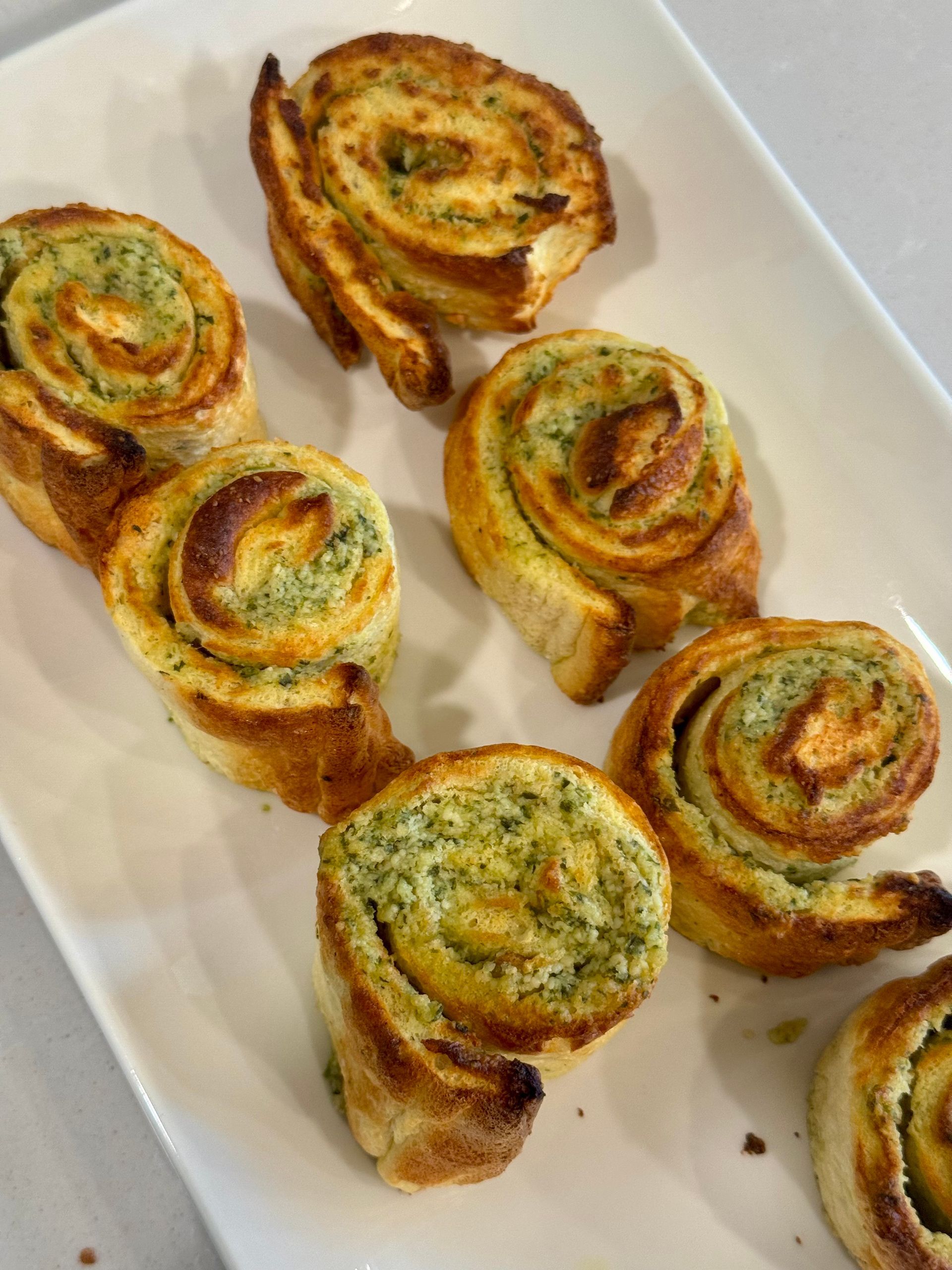 keto garlic roll ups. White plate with delicious garlic rolls