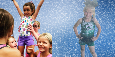 Two groups of young girls pose; one group is cheering, the other girl is in a blue sprinkle background wearing green.