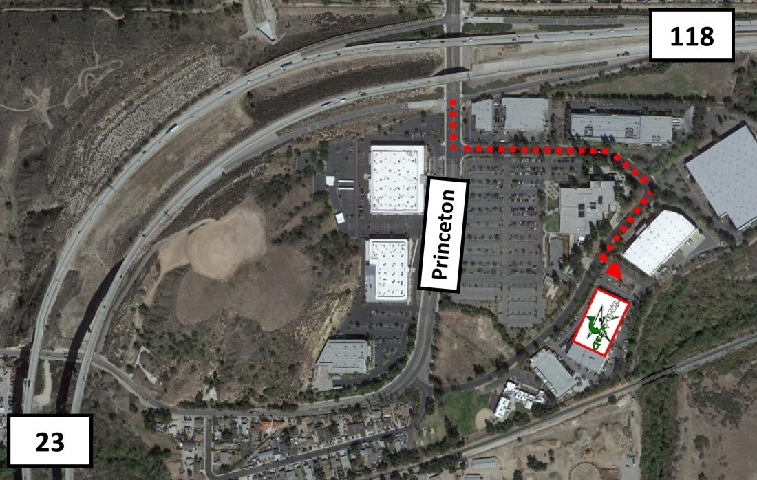 Aerial view of an industrial area. A red line indicates a route to a building off Princeton St. near Highway 23/118.