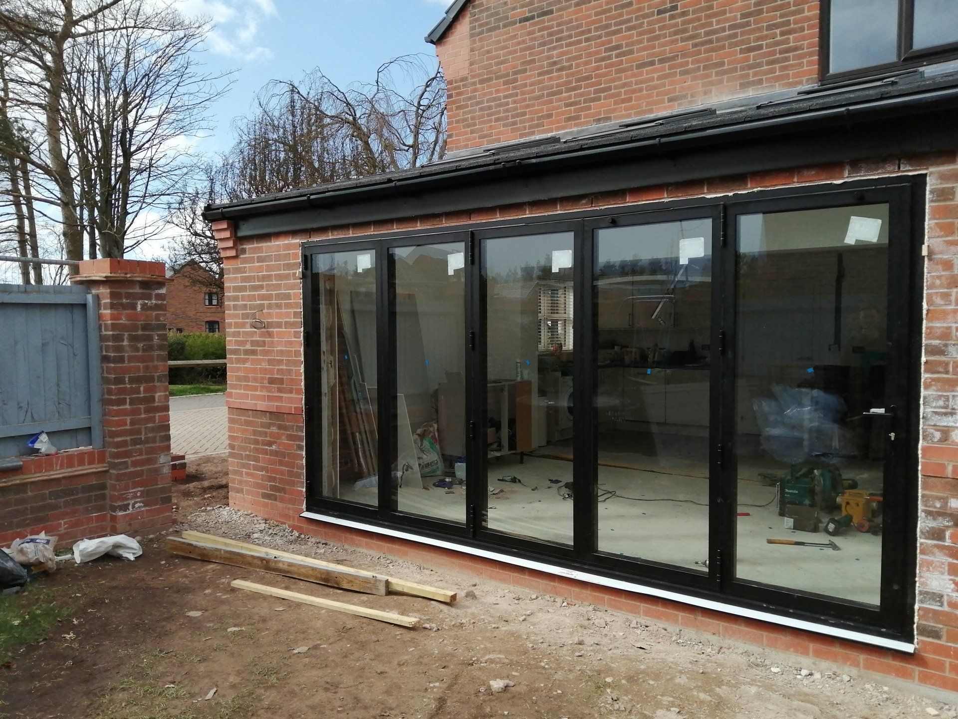 A house with a lot of windows is being built.
