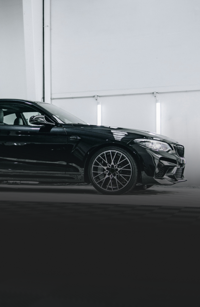 Car partially masked for painting in a body shop. | Ma's Auto Body