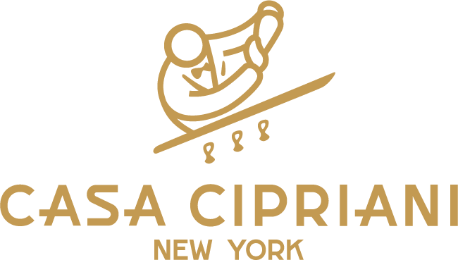 The logo for casa cipriani new york shows a person riding a sled down a hill.