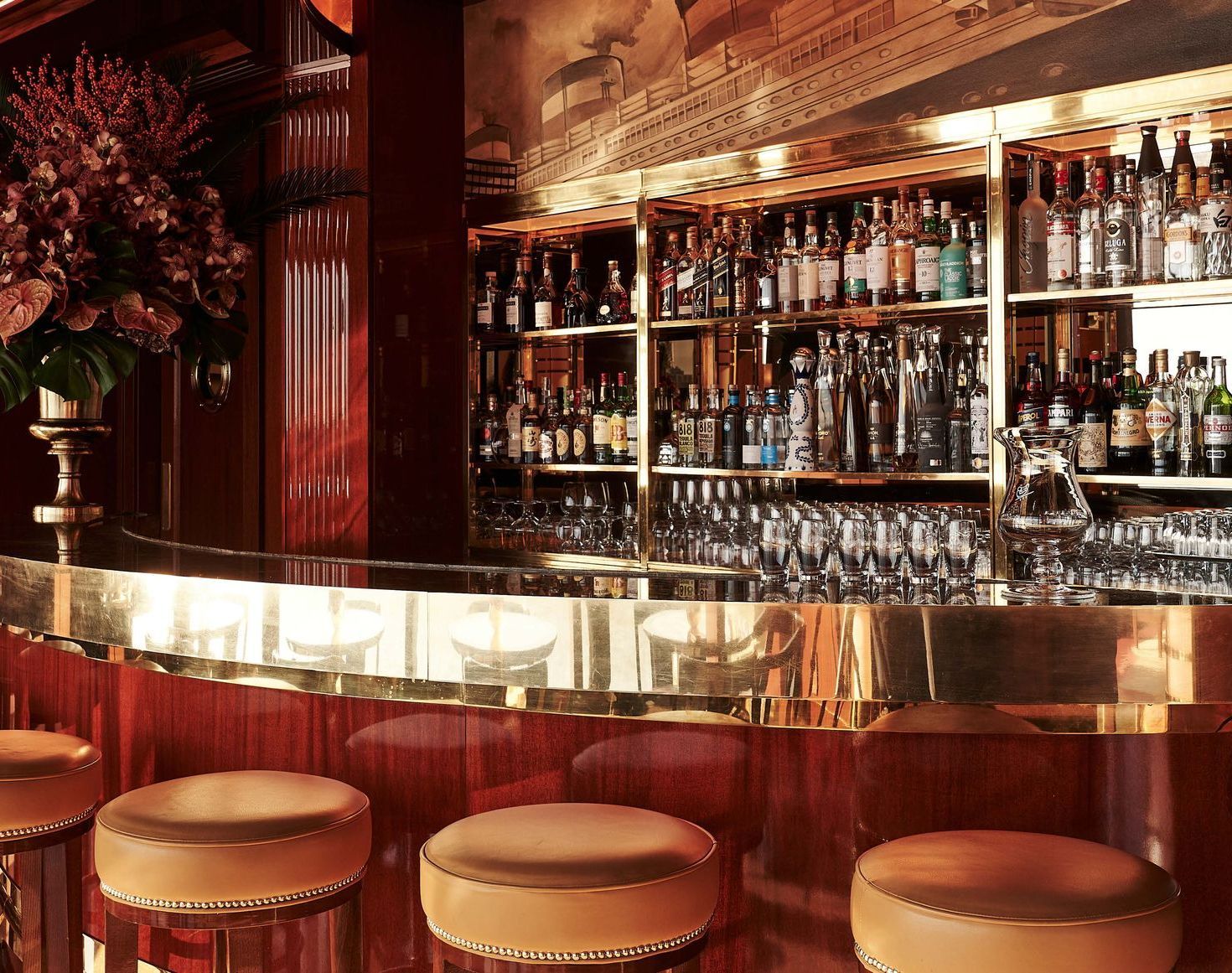 A table with a cup of coffee and a piece of cake on it