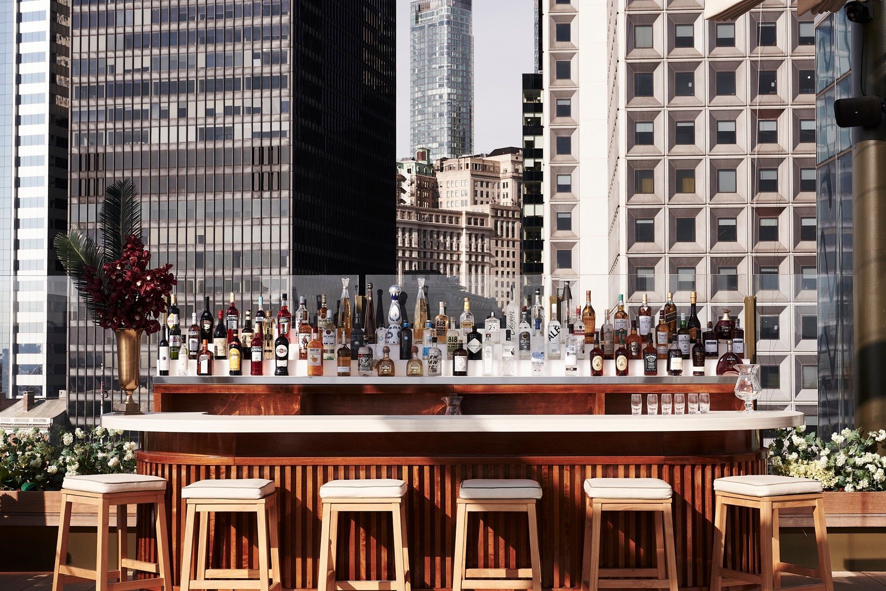 A bar with a city skyline in the background