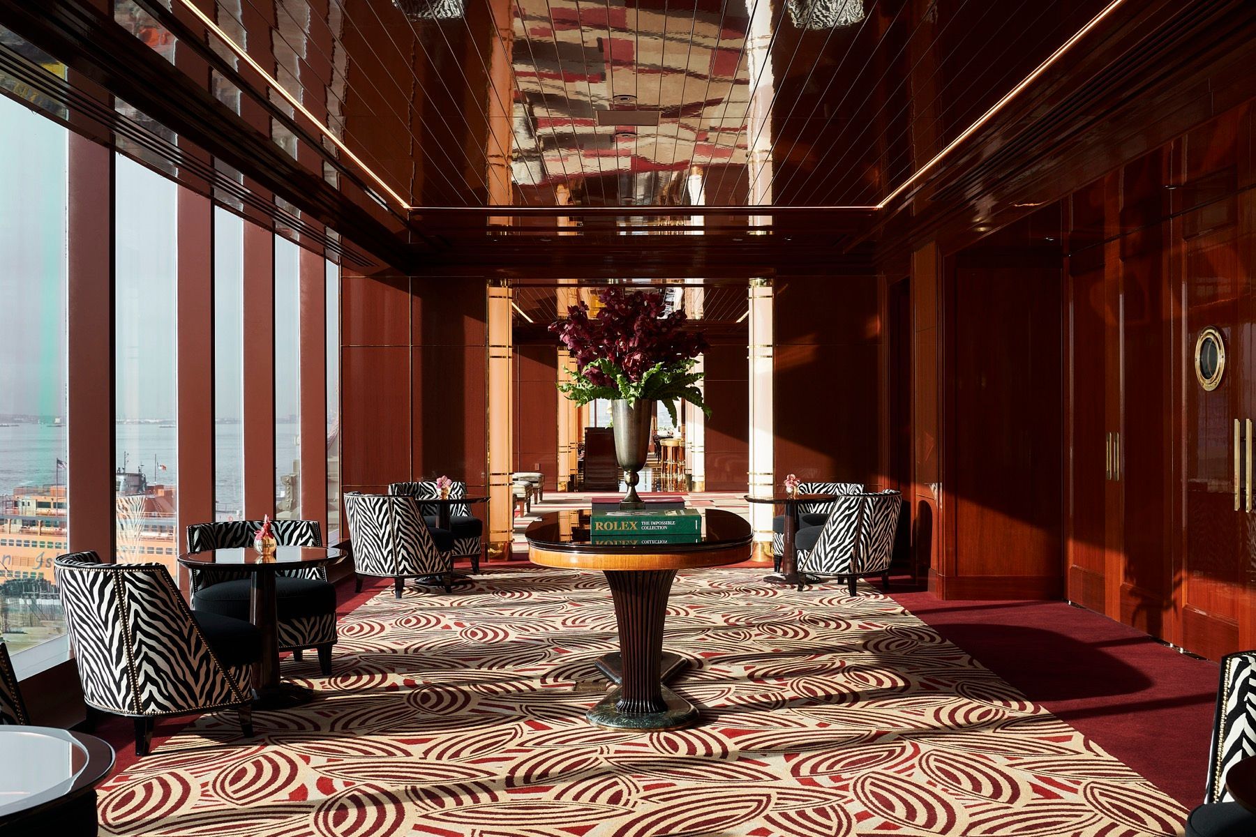 A large room with a table and chairs in it