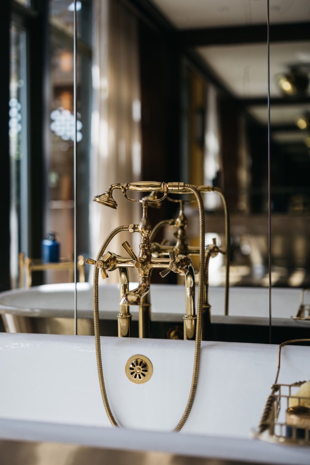 A bathtub with a faucet attached to it in a bathroom.