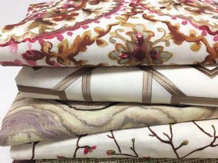 A stack of sheets with different patterns on them.