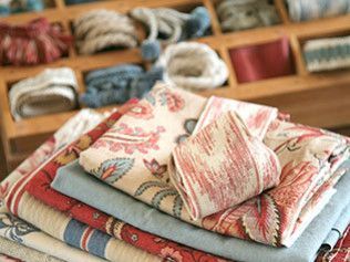 A stack of fabrics is sitting on top of each other on a table.