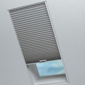 A window with a honeycomb blind on it.