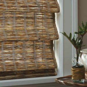 A window with a wicker blind on it