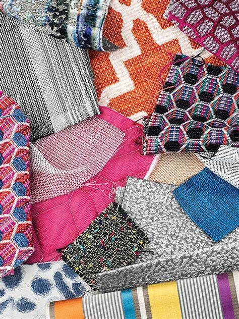 A bunch of different types of fabrics are stacked on top of each other.
