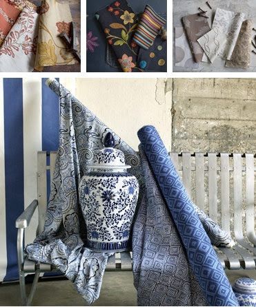 A blue and white vase is sitting on a bench