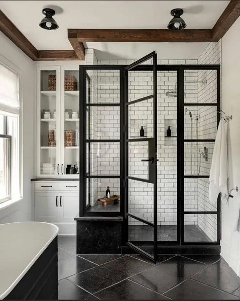 A bathroom with a walk in shower and a bathtub