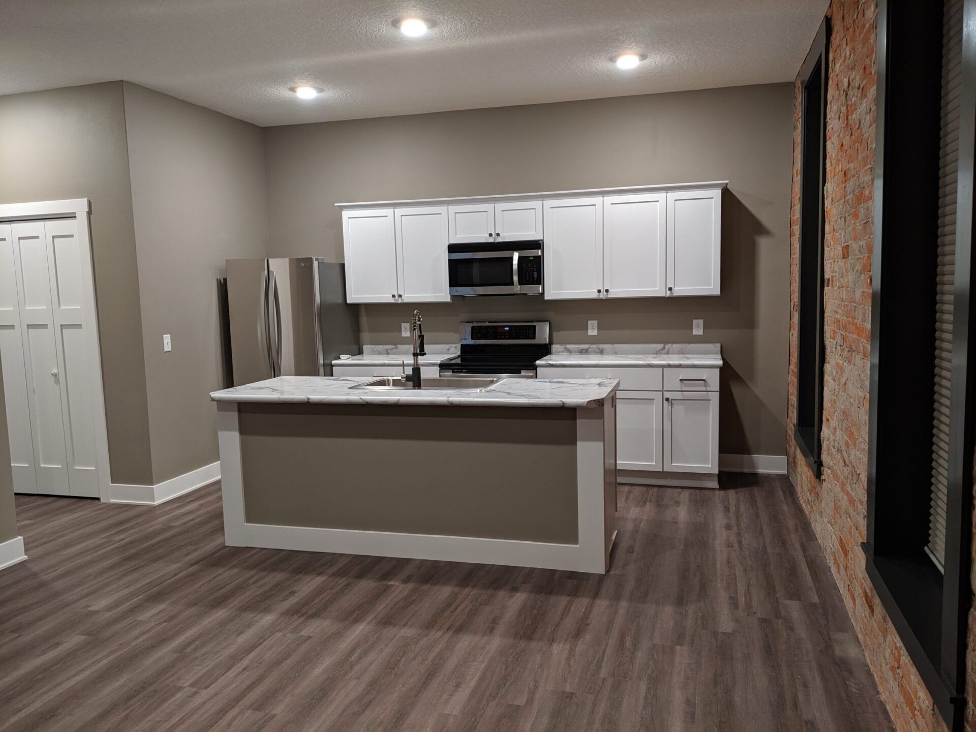 Cornerstone Building Kitchen Wooden Floor — New Sharon, IA — Lake Painting
