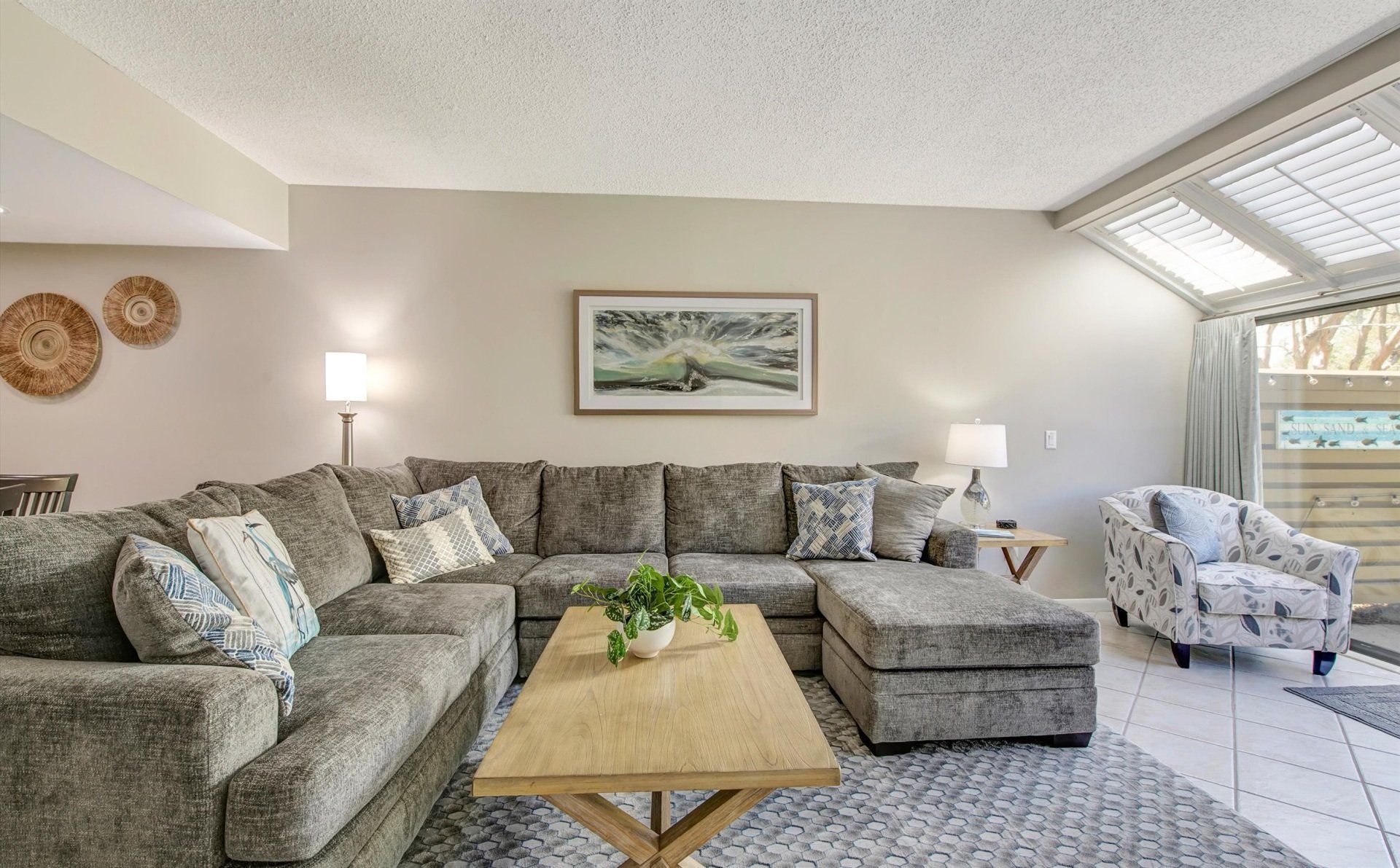 Gray sofa with a wooden center table