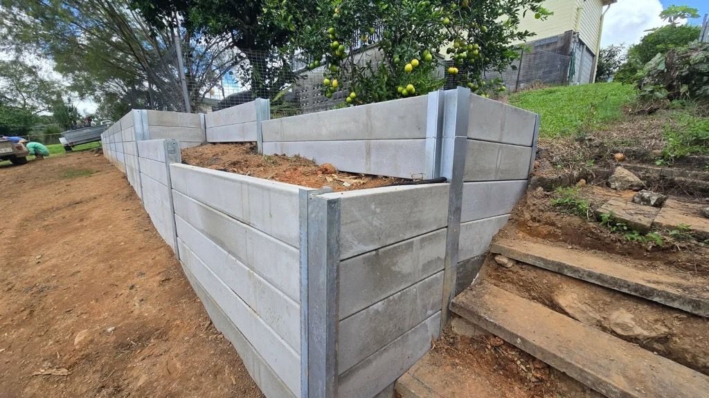 Raised Garden Bed With Gray Wood and Metal Posts — NQ Prefab Concrete Products Pty Ltd in Coconuts, QLD