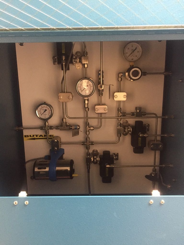 A blue box with a bunch of gauges on it