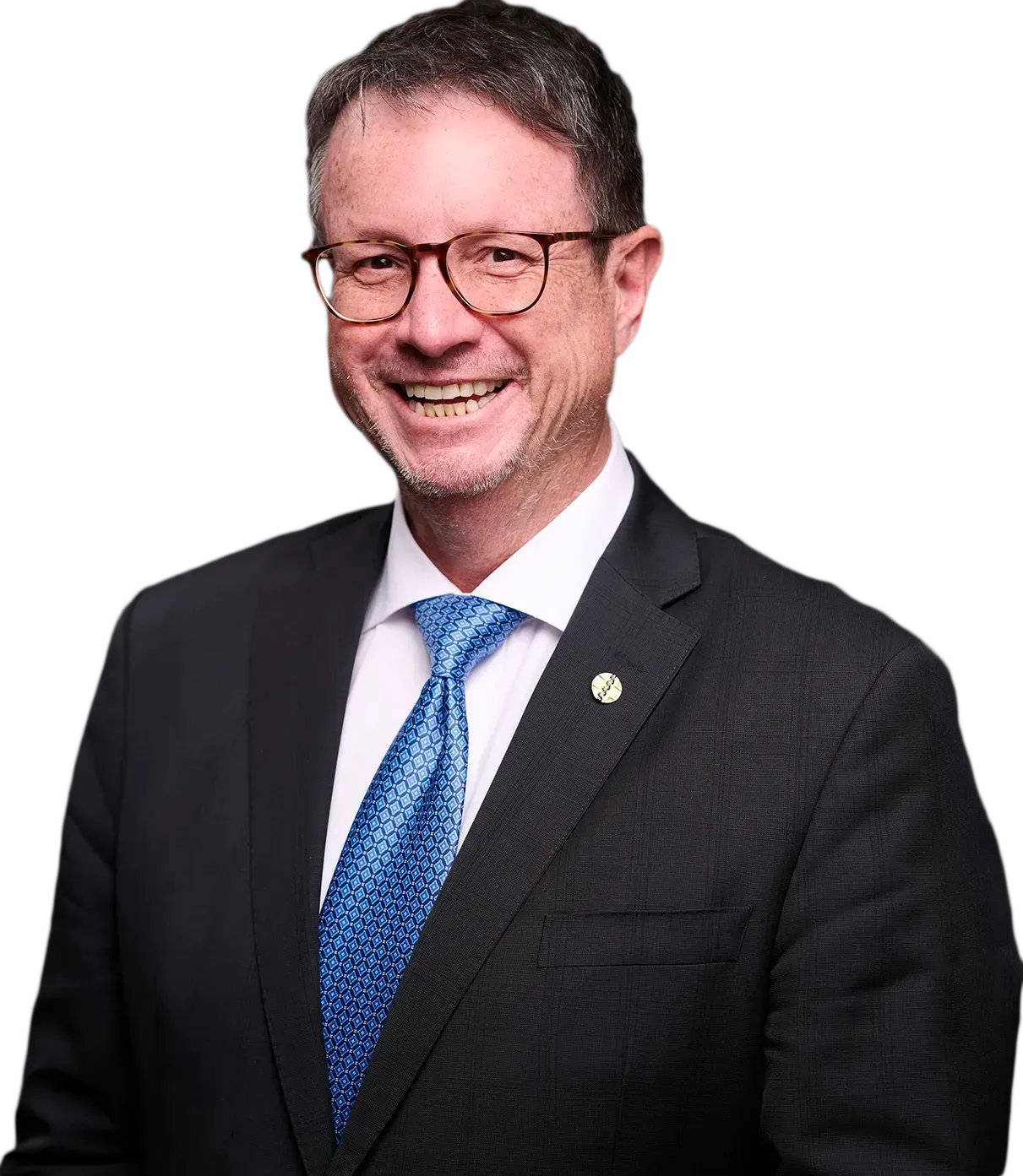 A man in a suit and glasses is smiling for the camera.