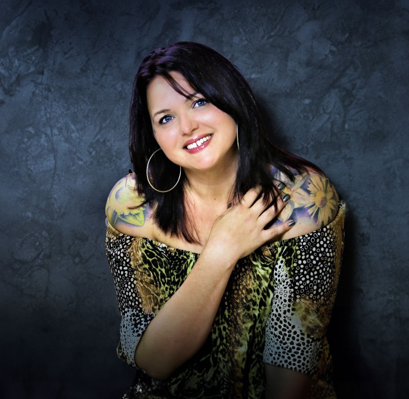 Beth Snyder, certified newborn photography instructor in Mokena, Illinois, smiling in studio