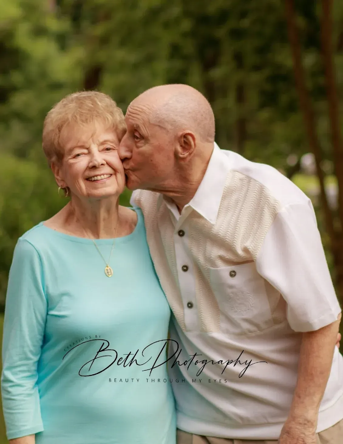 Elderly couple kissing portrait