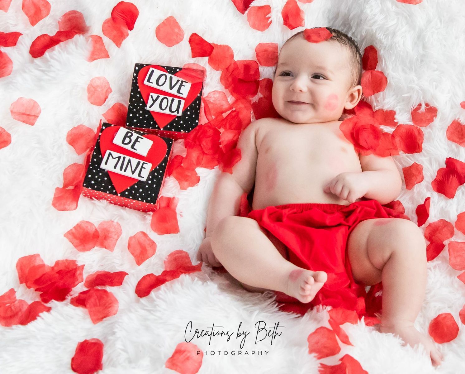 baby in rose petals photo session