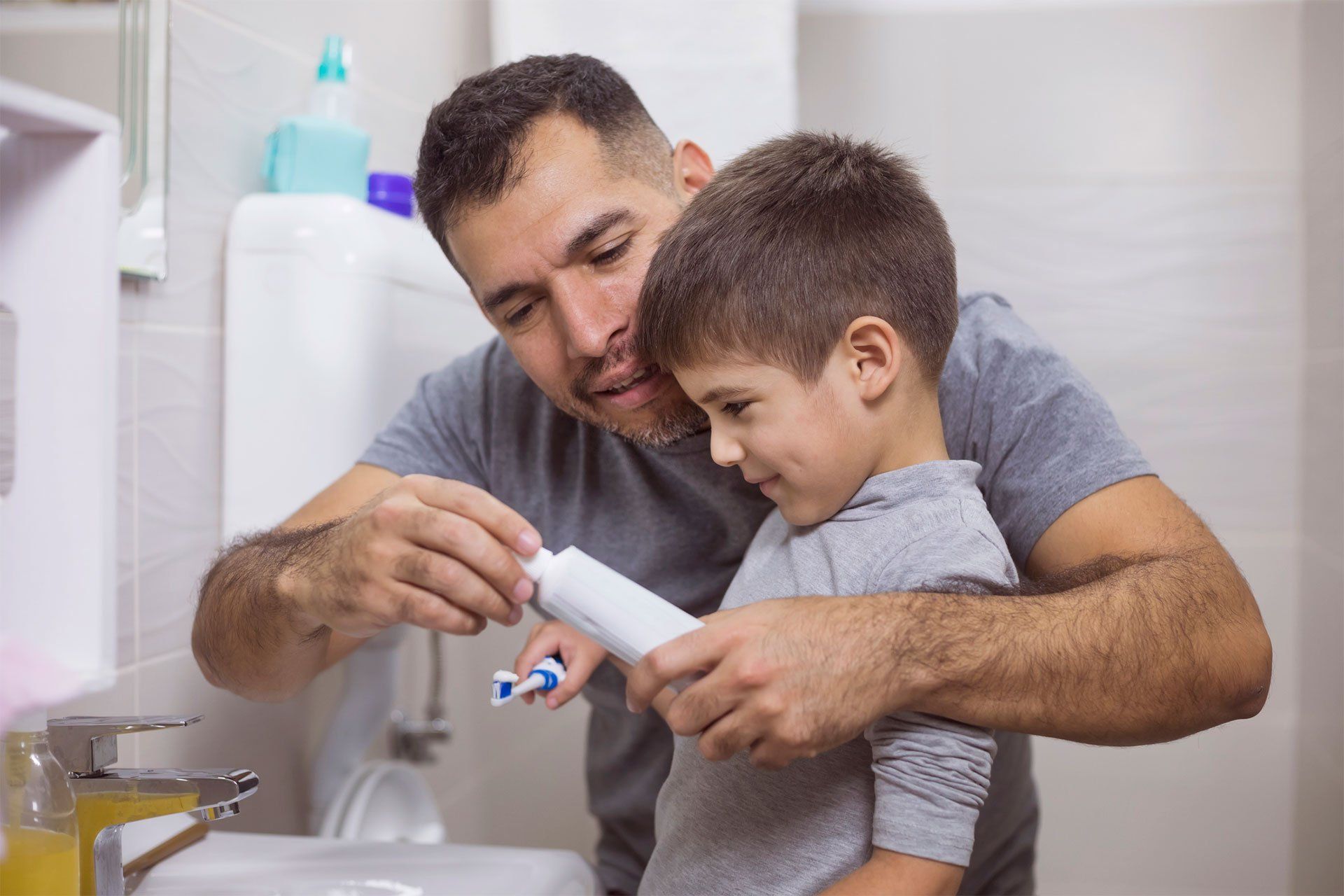 Father Teaching Son How To Brush His Teeth — Edina, MN — Interlachen Dental Associates