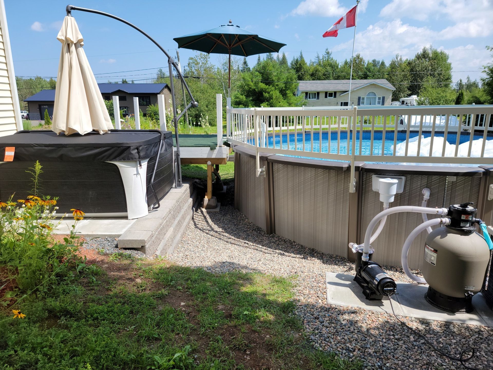 There is a hot tub and a pool in the backyard.