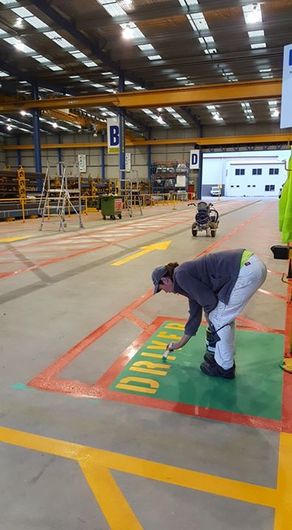 Racers racing on the track marked by marking service providers