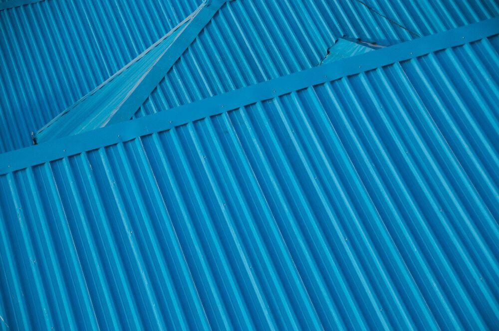 A Close Up of a Blue Corrugated Metal Roof — Flow Kitchens in Taree South, NSW