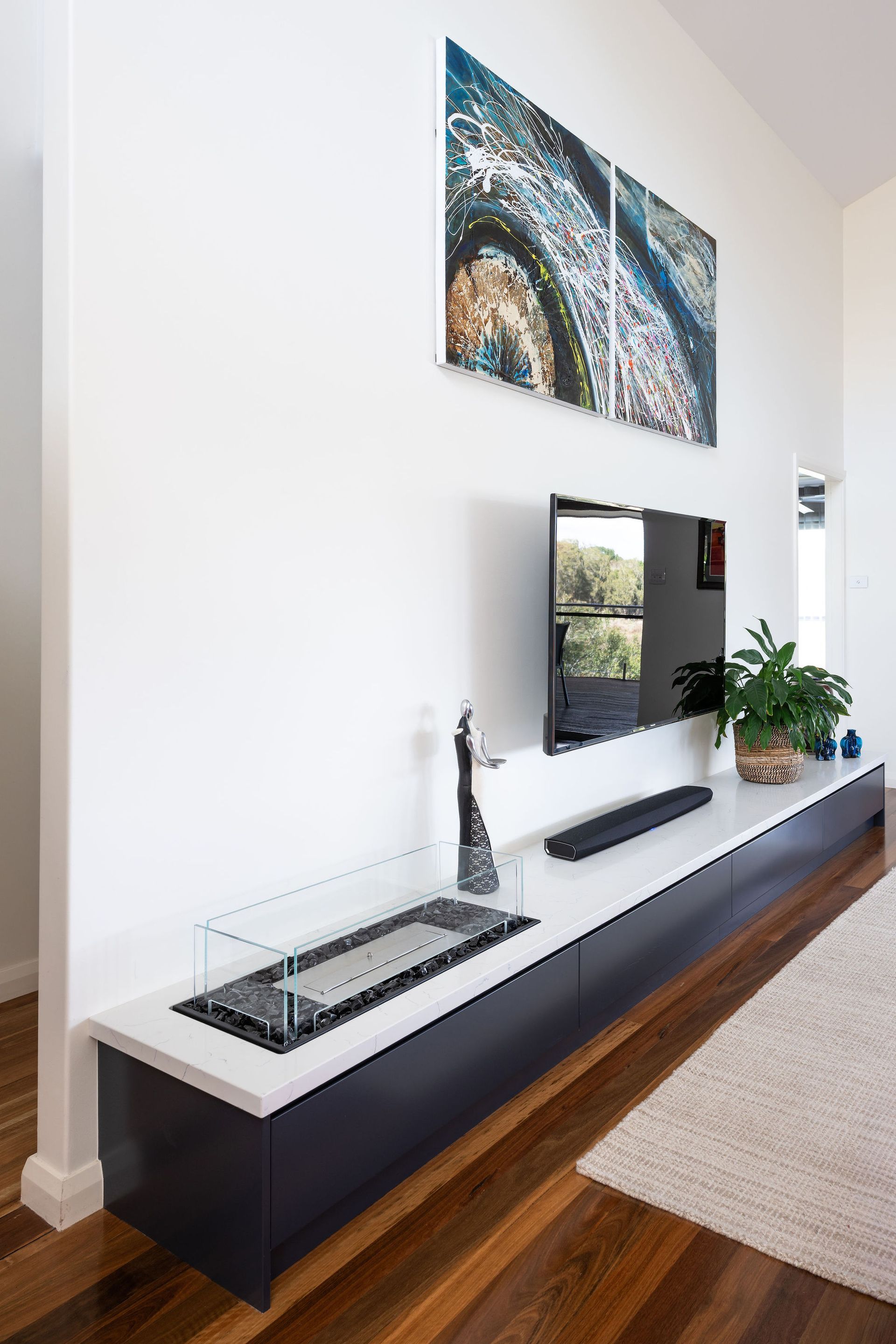 Modern Living Room With Floating Media Console, Tv, Art, and a Fireplace Insert — Flow Kitchens in Taree South, NSW