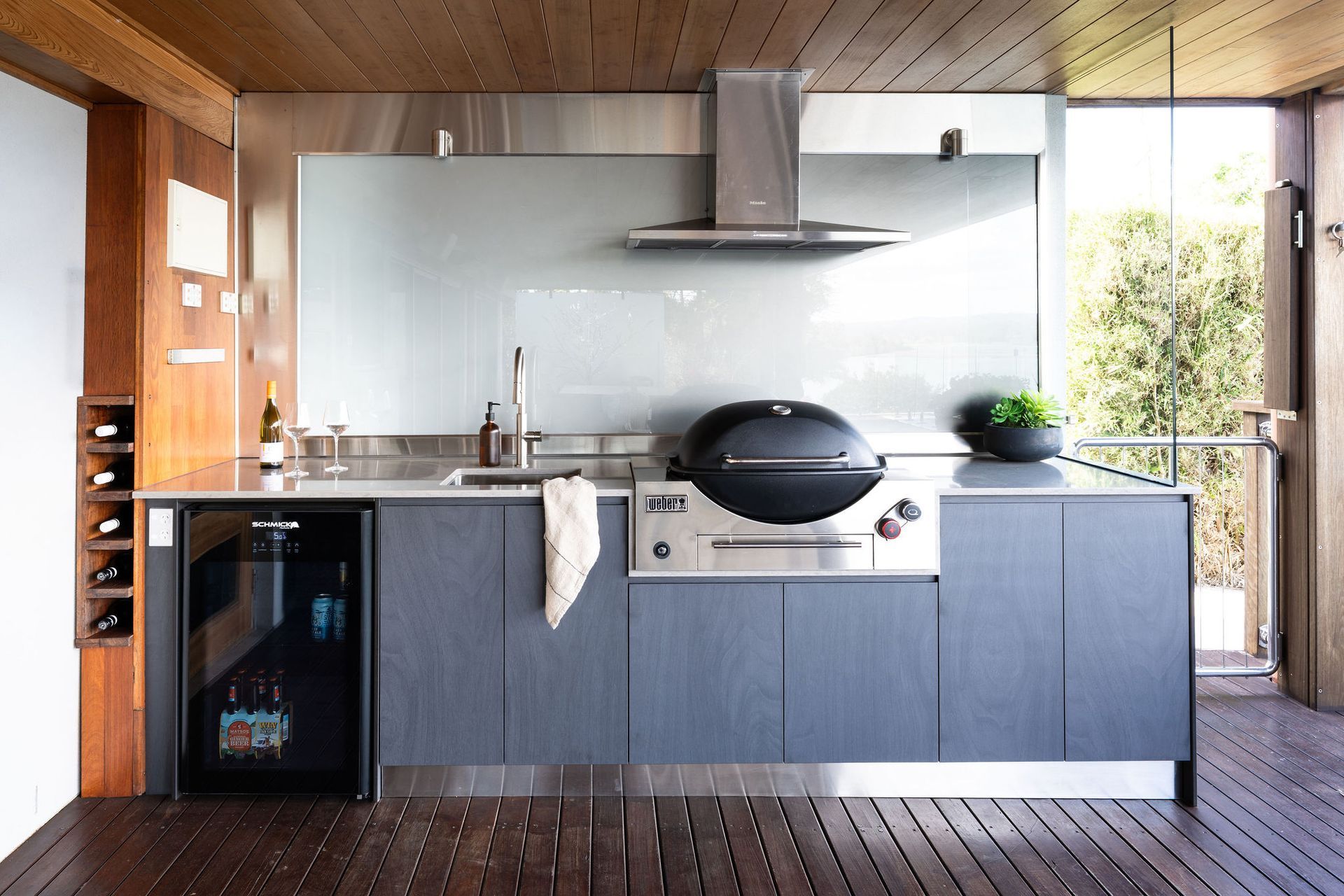 Outdoor kitchen with grill, sink, wine fridge, and gray cabinets. — Flow Kitchens in Taree South, NSW