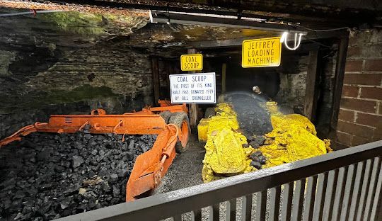 A sunset over a mountain range with a lot of fog