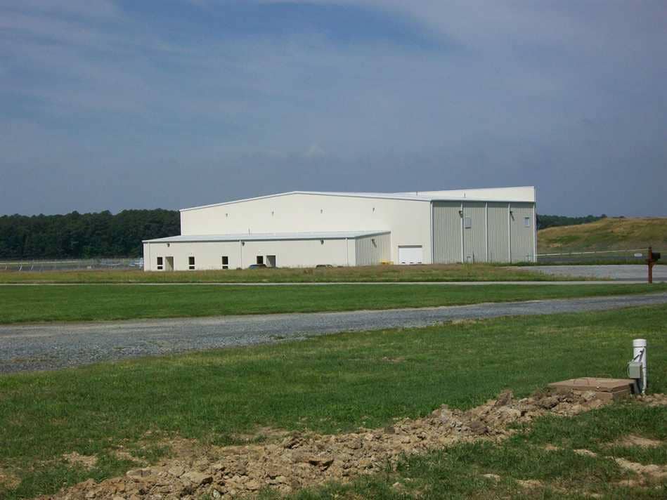 Steel Warehouse Repairs — White Building On Field in Seaford, DE