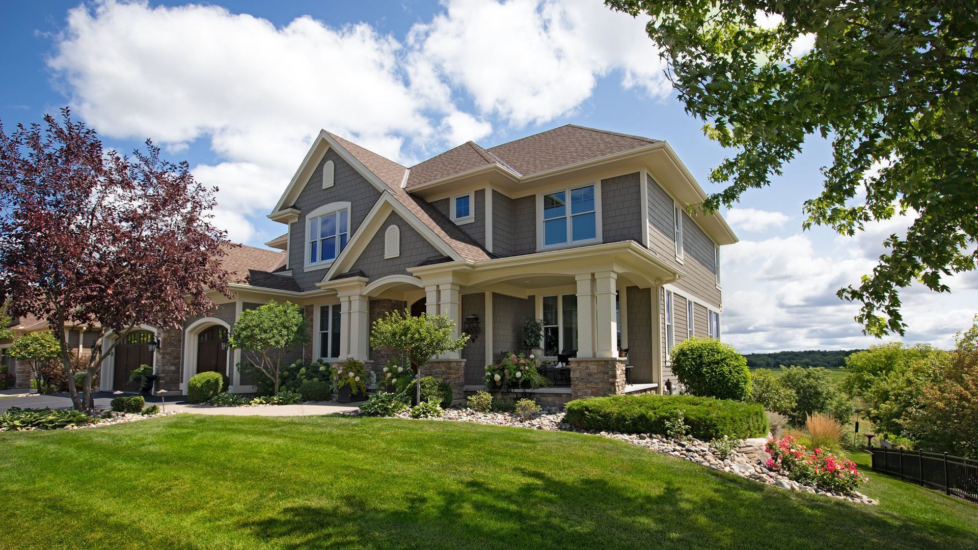 outside home with new windows and roofing in Springfield MO