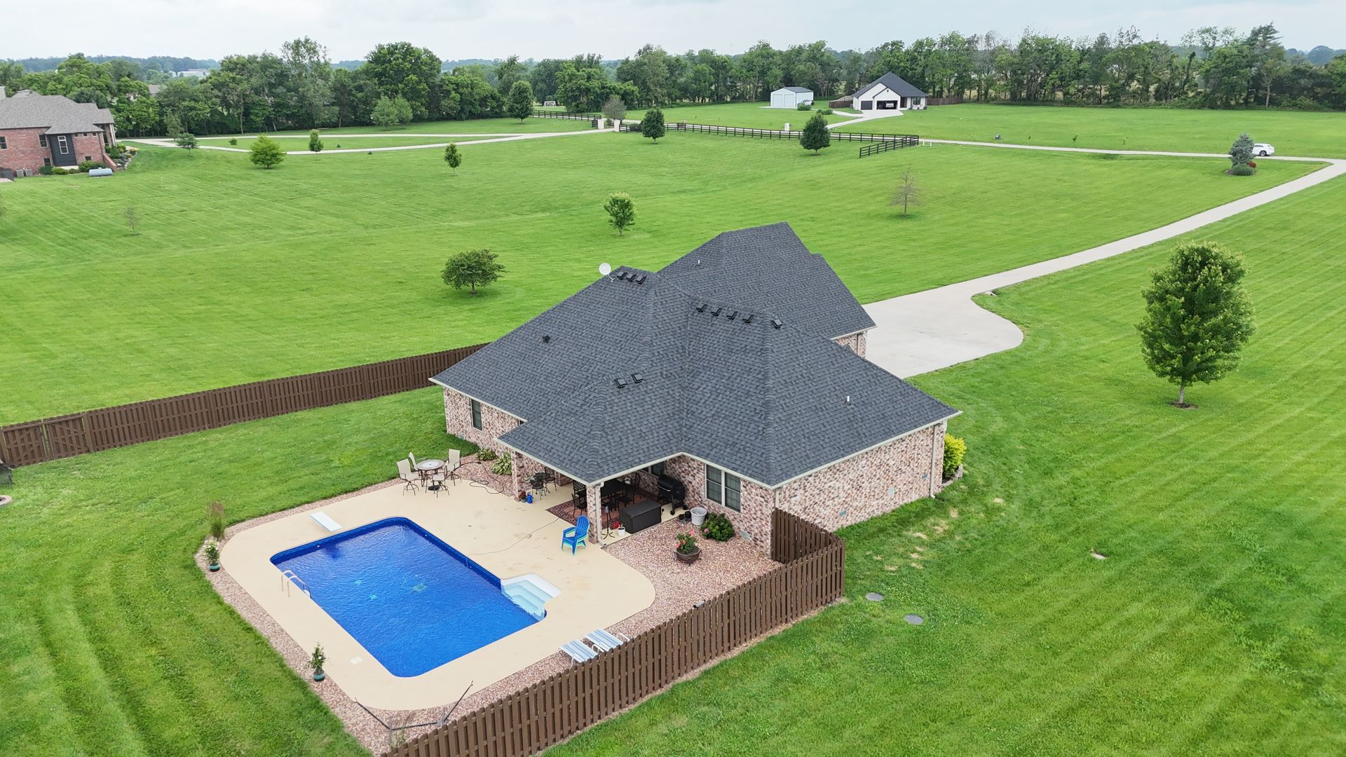Best roofing company in Springfield, MO | Home with pool and new roof