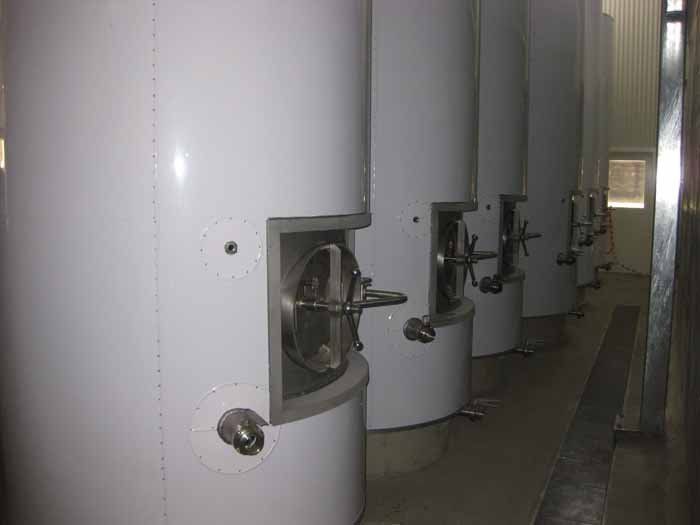 smaller white tanks in warehouse