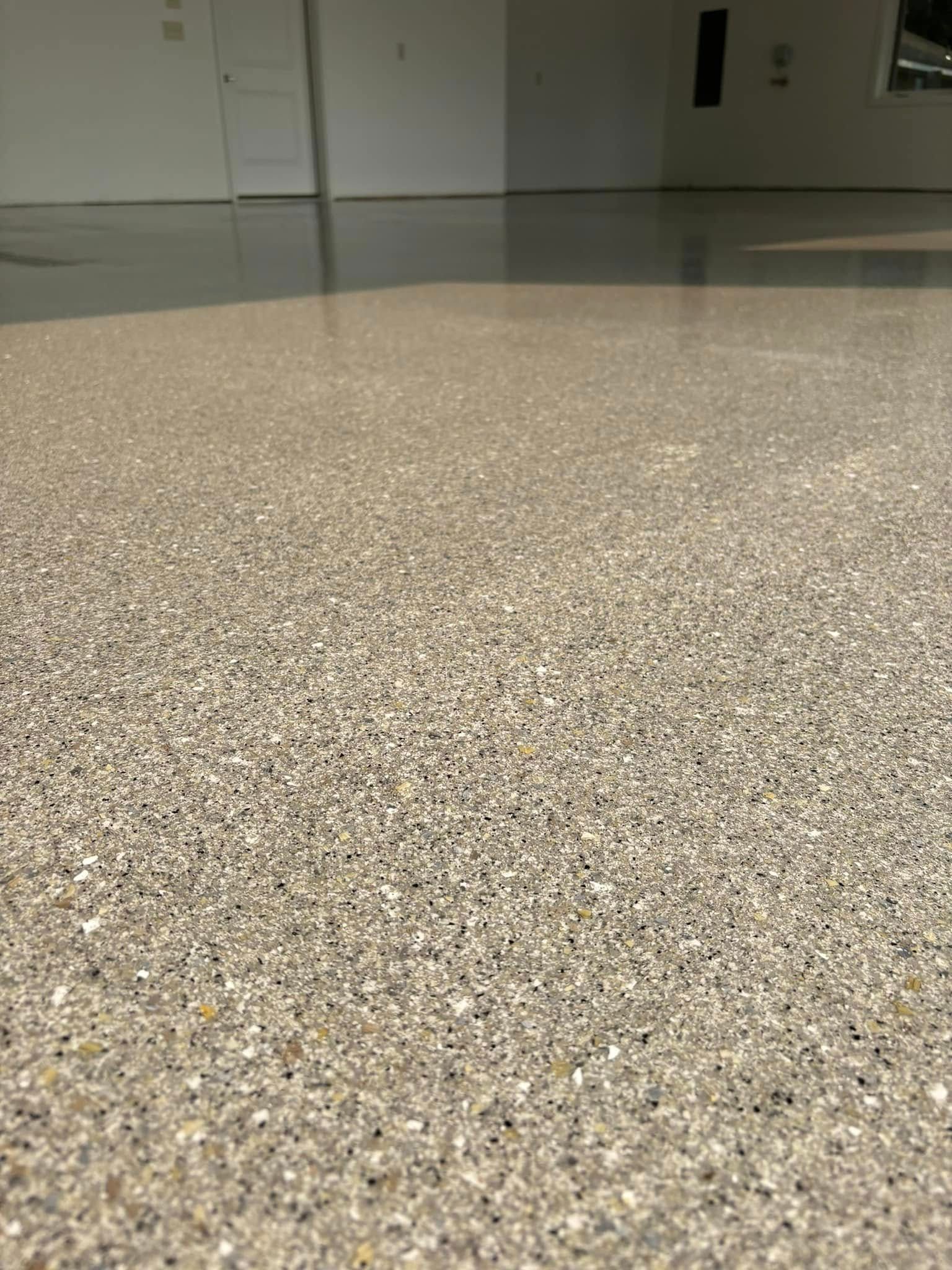 A close up of a shiny floor in a room.