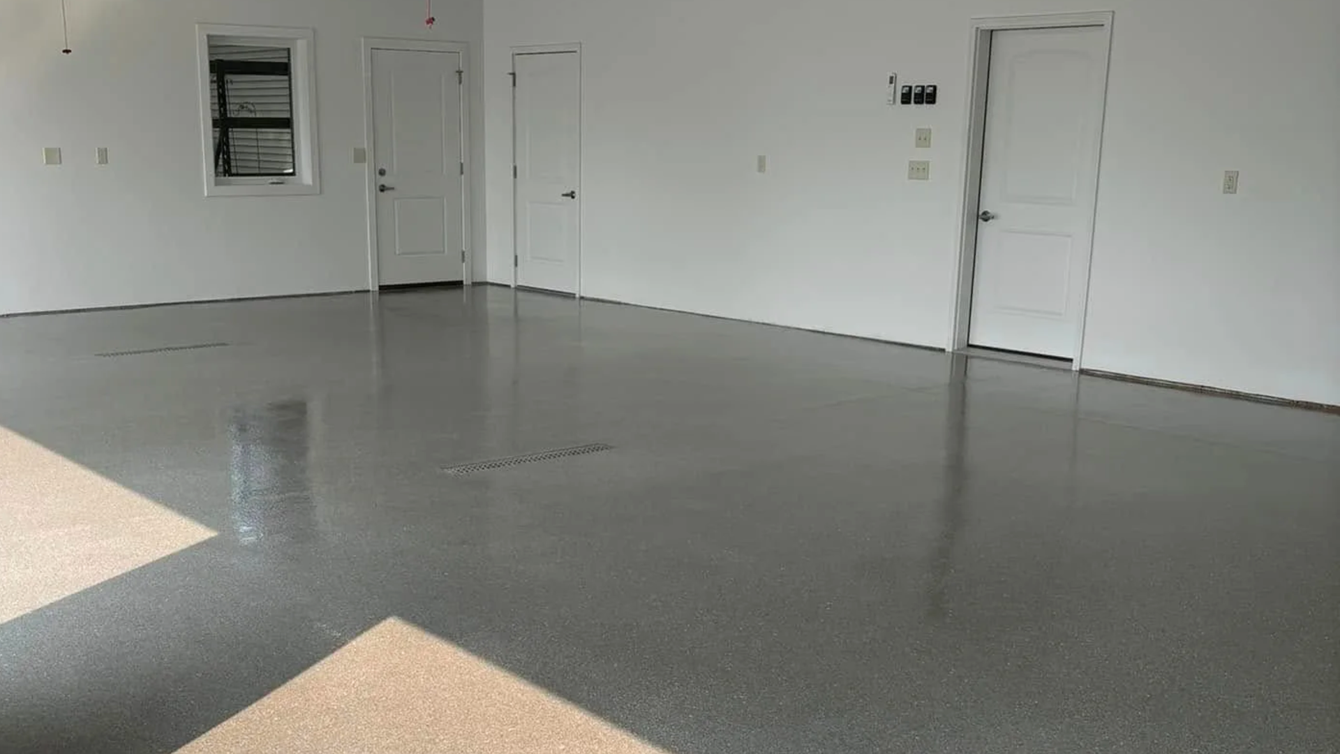 Concrete flooring with epoxy surface finish installed on a St. Cloud property by Viper Concrete