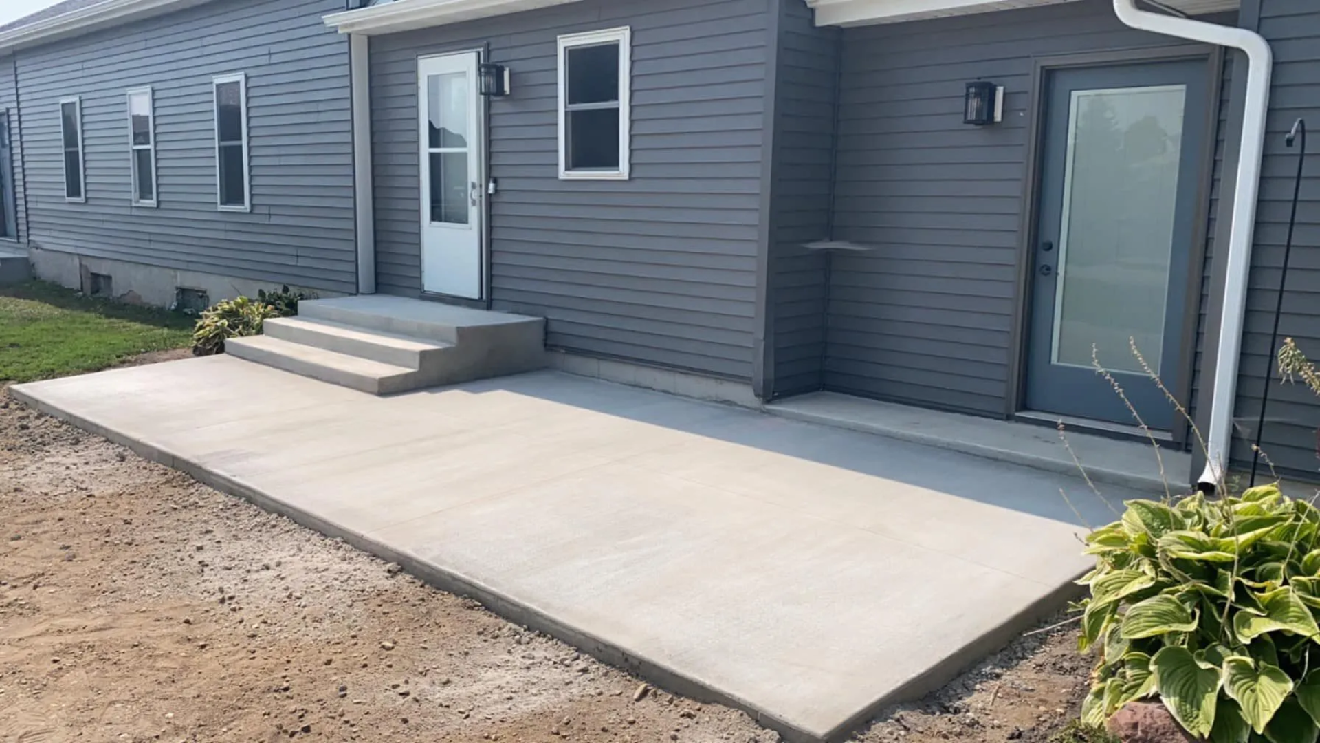 Concrete patio installation completed on a St. Cloud property by Viper Concrete & Epoxy.