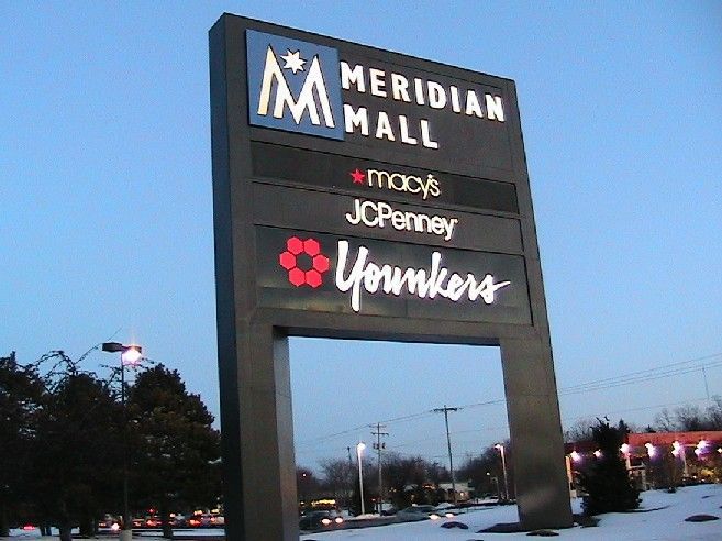 Meridian Mall sign with Macy's, JCPenney, and Younkers logos; set against a twilight sky.