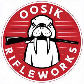 Logo: Angry walrus holding rifle in its mouth; red and white circle; 