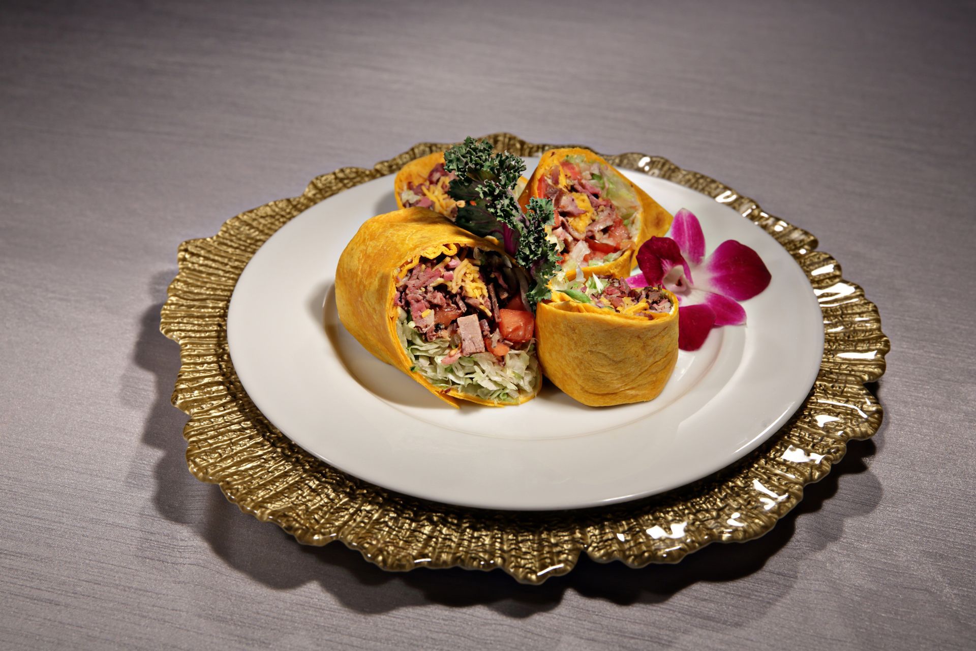 A plate of food with a flower on it