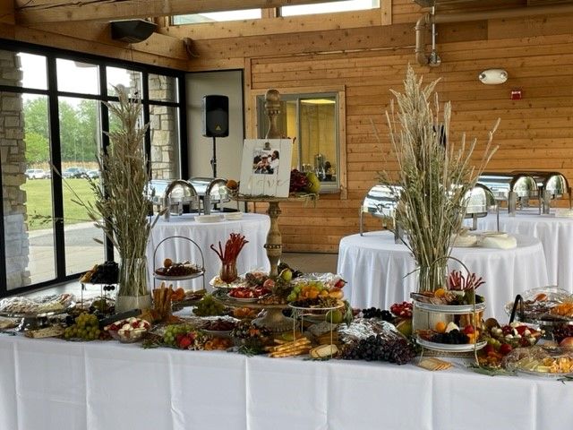 A buffet table with fruits and vegetables on it