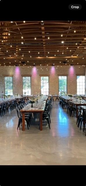 A large room filled with tables and chairs.