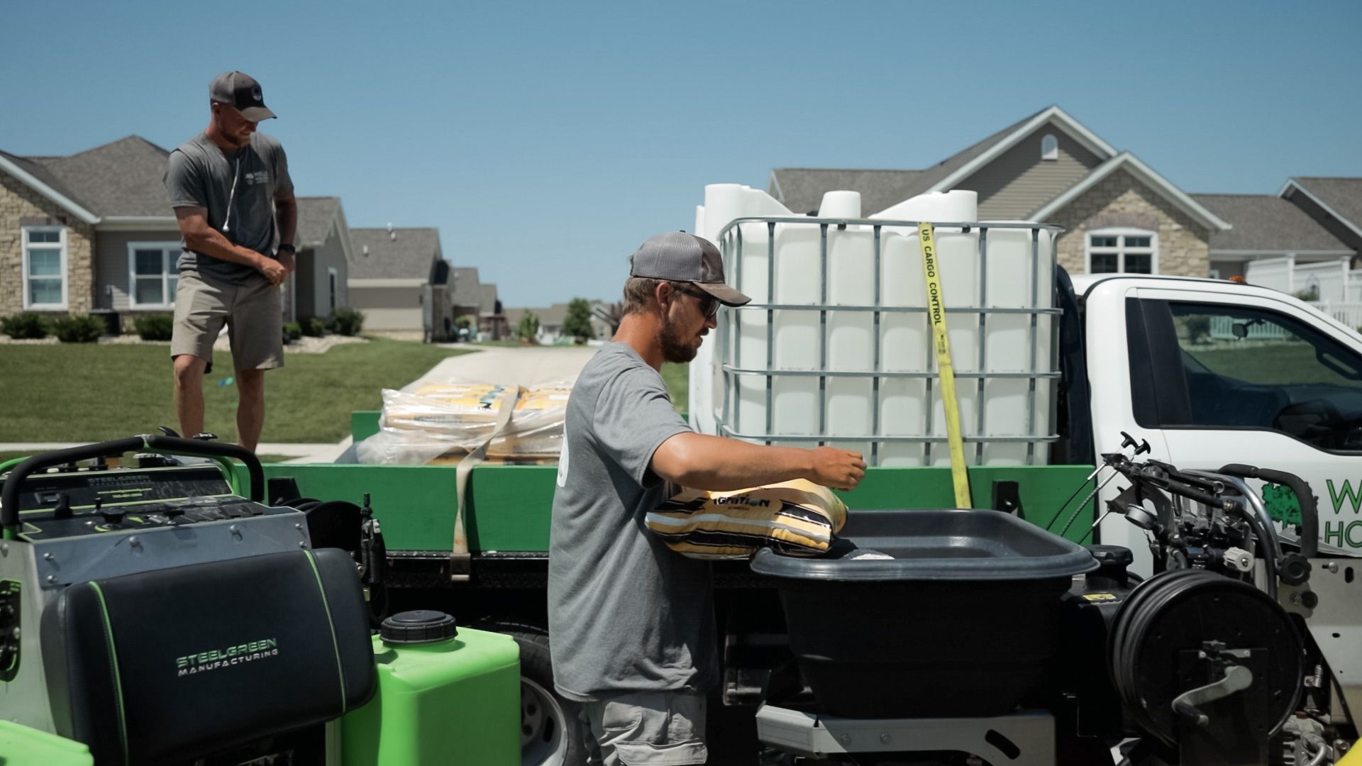 Wells Hollow employees getting ready to complete lawn care. 