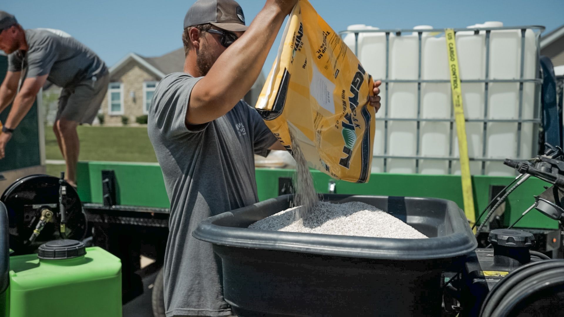 A Wells Hollow employee getting ready to complete lawn care. 