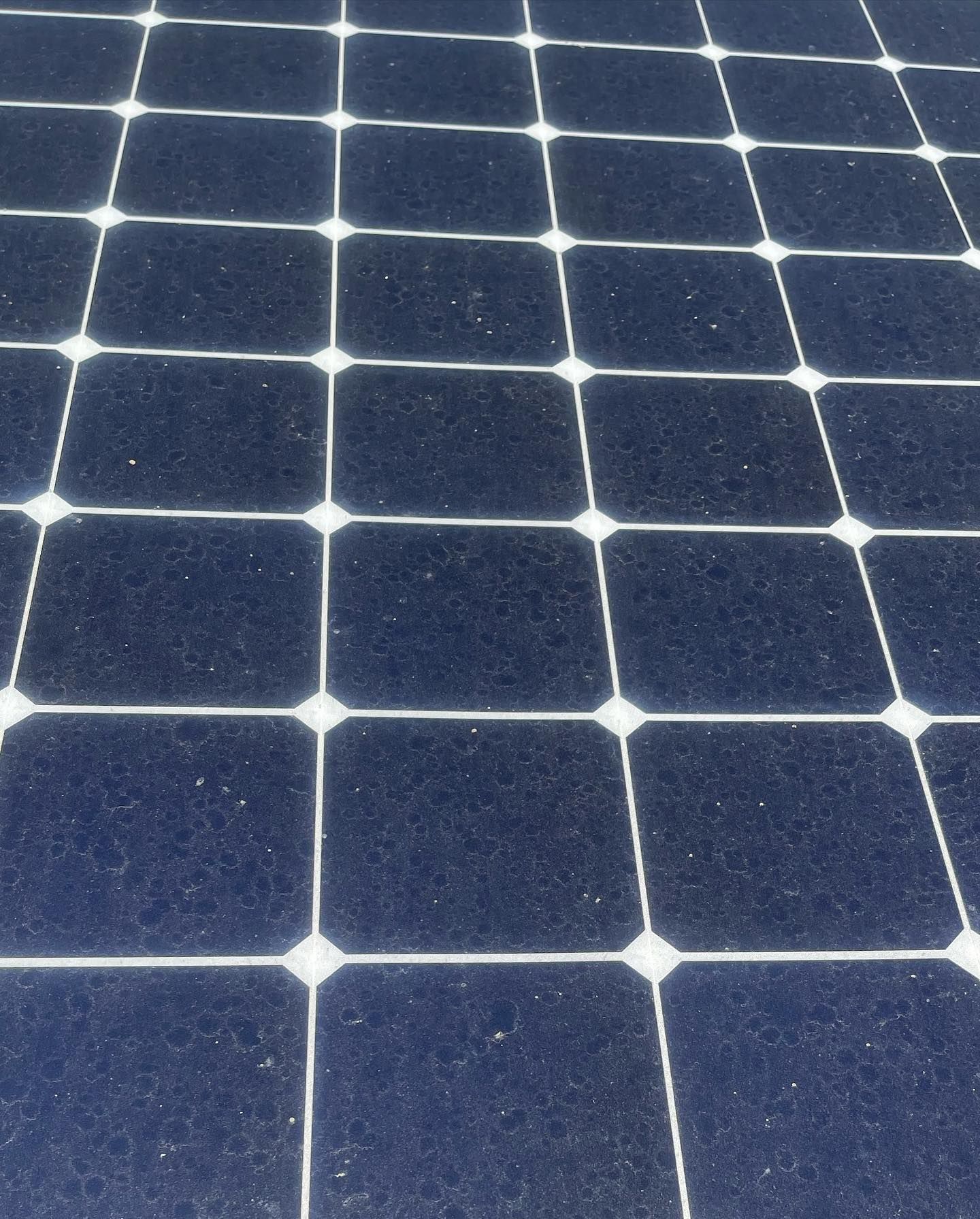 A close up of a solar panel with a grid pattern