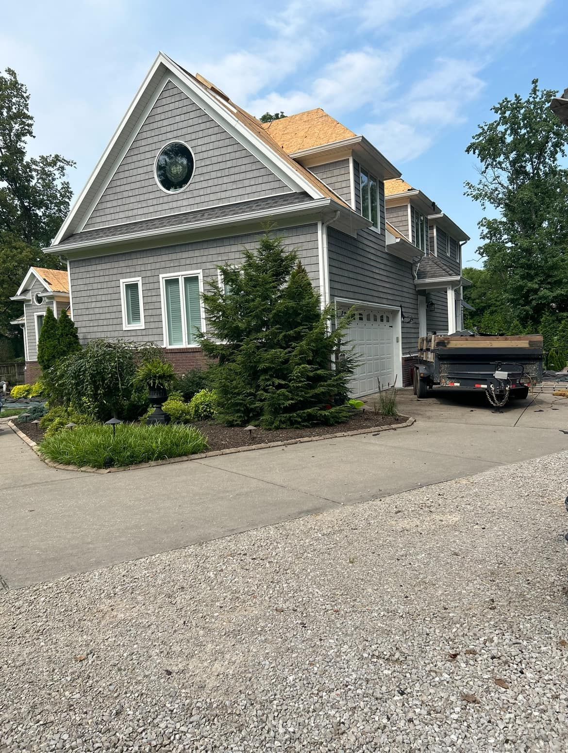 A large house with a truck parked in front of it.